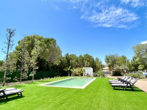 Private swimming pool with sunbeds