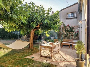 Outside dining and relaxing hammock between the mulberry trees