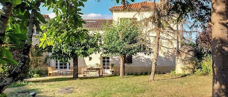 Cottage, to the left, seen from the garden
