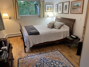 Master bedroom with a queen size bed