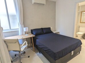 Suite 2. Air conditioner, ceiling fan, built-in armoire, work desk, black-out curtains.