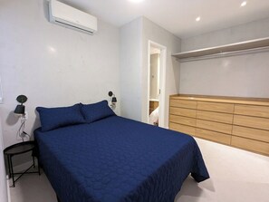 Suite 1. Ceiling fan, built-in armoire, A/C, Persian curtains.