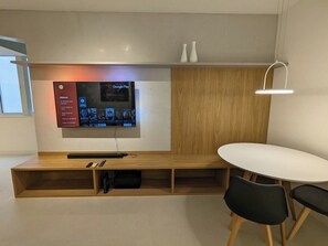 Dinnertable integrated with TV rack. Seating for 4.