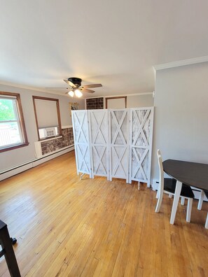 Dining area / room divider w/queen bed & day bed in back