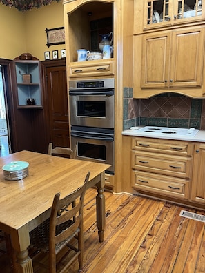 The kitchen has a double oven.  The floor is original pine wood.