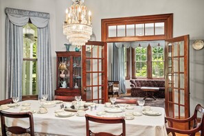 Enjoy a memorable meal in the dining room. Double doors open to the living room.