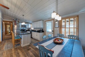 Dining room table with kitchen