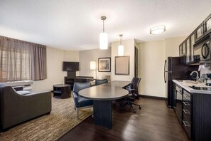 Living room, dining table and kitchen