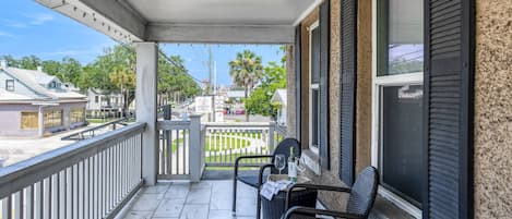 Enjoy a glass of wine while people-watching from the balcony.