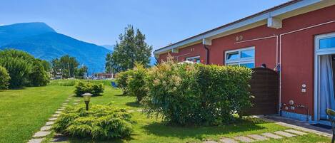 Plant, Sky, Property, Green, Blue, Window, Tree, Natural Landscape, Land Lot, Grass