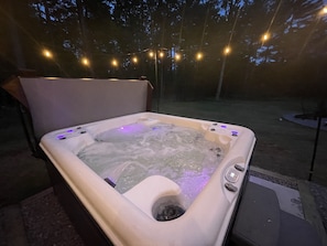 Indulge in spa like relaxation under the starry sky, surrounded by enchanting string lights, while enjoying your favorite tunes through Bluetooth speakers.