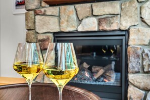 Curl up by the fireplace, sip wine, and let the cozy ambiance soothe your soul