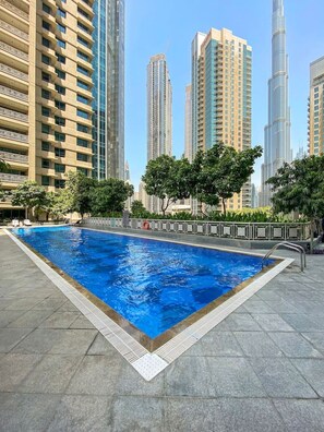 Outdoor Oasis: Dive into relaxation by the shimmering pool with stunning skyline views!