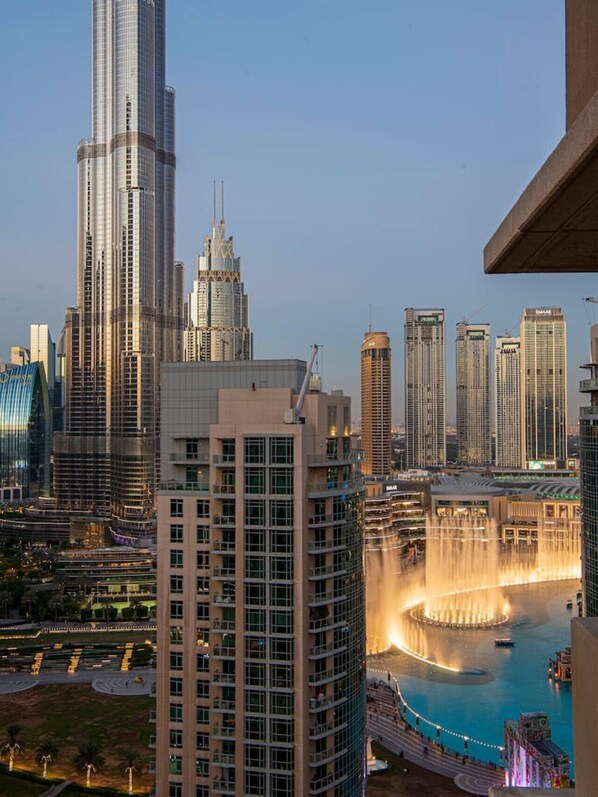 Stunning View: Marvel at the Dubai Fountain and skyline from your private balcony!