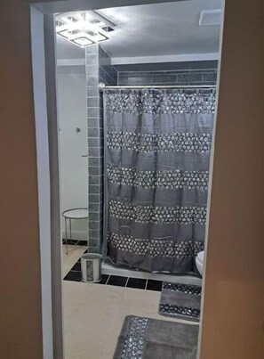 Downstairs bathroom with soaking tub 