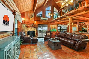 Interior view of the living room and loft area of home.