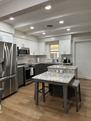 Beautiful appointed kitchen with island to have your morning coffee.