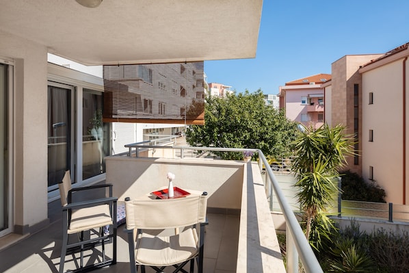 Roofed terrace with sitting area