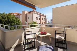 Roofed terrace with sitting area