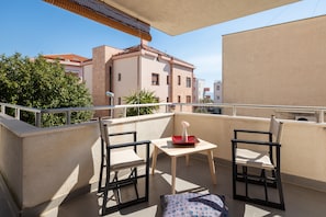 Roofed terrace with sitting area