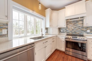 Fully equipped kitchen with pots, pans, and flatware for your group!