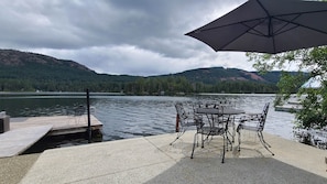 Enjoy morning coffee or dinner from this concrete deck situated at waters edge.