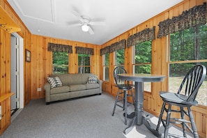 Entryway sunroom with couch that pulls out into queen size bed