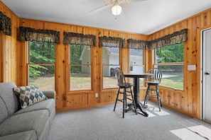 Entryway sunroom with couch that pulls out into queen size bed