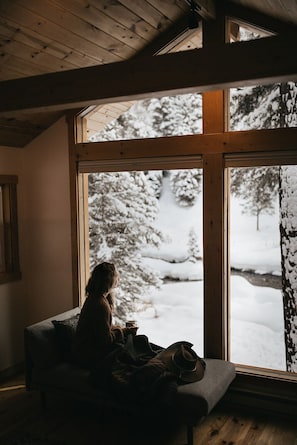 River's Edge is a studio cabin with floor-to-ceiling windows to Aspen's pristine natural setting.