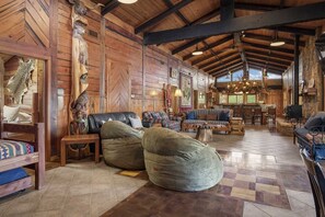 Four enormous couches and two queen-sized chair/beds provide plush and comfy seating in the wide-open living area!