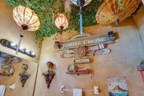 Embark on a wild adventure in the Jungle Cruise-themed room, filled with playful touches and safari-inspired charm for explorers of all ages.