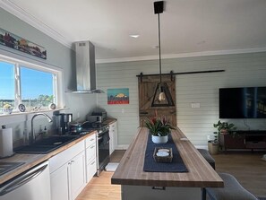 Kitchen with Bedroom Door in Background