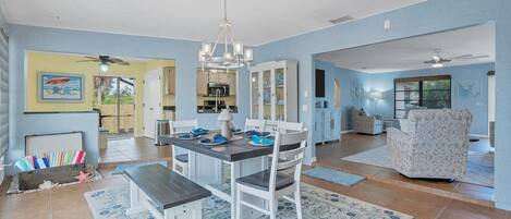 Bright and open dining room overlooks the canal and lanai