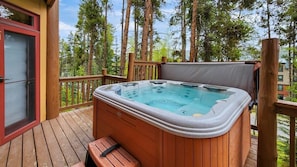 Ease sore muscles after a day on the slopes or hiking trails in the private hot tub while you take in the views over the trees.