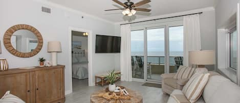 Living area with smart TV and gulf view with access to balcony