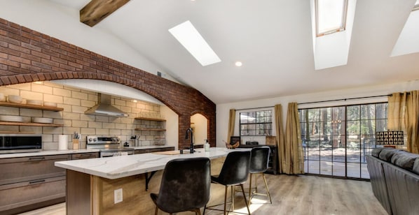 This inviting kitchen was remodeled with guest in mind. Open shelving makes everything easy to find.