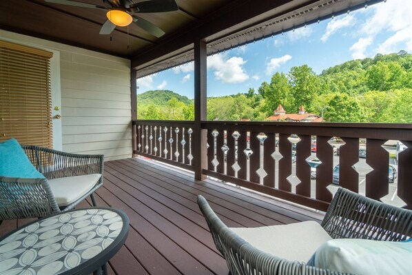 Relax and enjoy the view on this cozy back porch