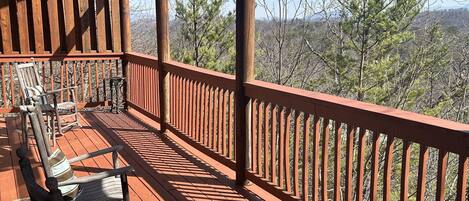 Enjoy the fresh mountain air from the back deck. Plenty of outdoor seating to enjoy the views.