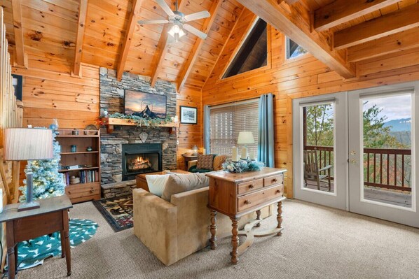 Comfortable furniture, gas fireplace, large Smart TV and lots of natural light make the living room the perfect gathering space.