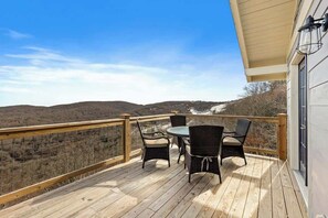 Deck Delight: Multiple outdoor decks with cozy seating areas invite you to soak in the gorgeous natural environment. Revel in the tranquility and beauty that surrounds you.