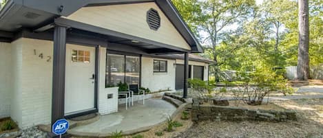 Front of the home, featuring front patio seating