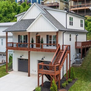 Two car garage includes two outlets for charging electric cars. 