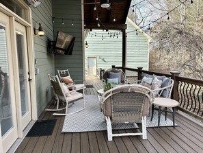 This covered patio is a favorite spot for all of our guests! You will enjoy a gas grill, TV with cable/Netflix, outdoor space heater for the winter, comfortable seating, and cafe lights for a relaxing evening ambiance. It just can't get any better!