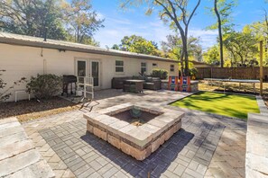 Lively backyard with games, a fire pit, and space to unwind.
