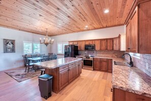 Gather and connect in our inviting open-concept space. The kitchen is a chef's dream, featuring premium appliances and plenty of room to cook and entertain.