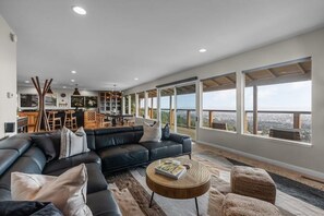 Open concept upstairs living and dining area with a view of the entire bay area