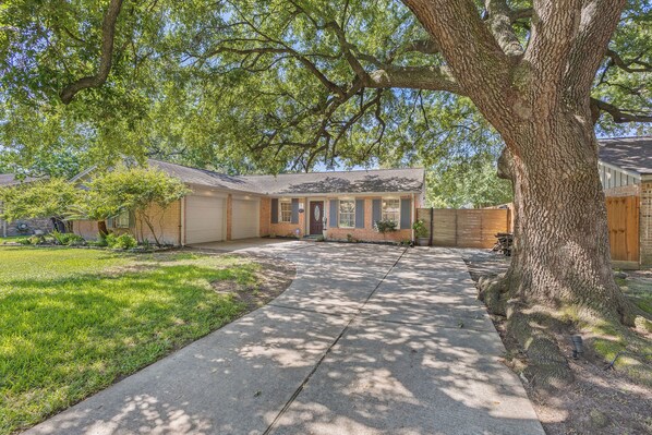 Large La shaped driveway with 150 year old Oak tree to welcome you home.