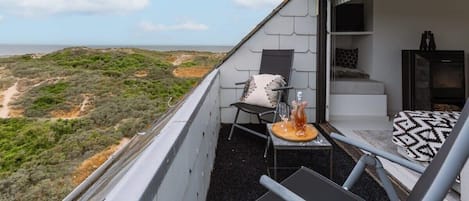 Cozy terrace with beautiful views of the dunes and the sea