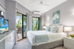 Bedroom with queen bed and access to the balcony