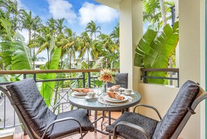 Balcony with dining table and chairs